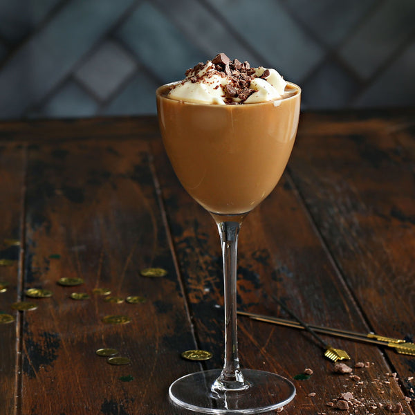 A Barrel Aged Irish Mudslide with vodka, coffee liqueur, Irish cream, and Rustic Oak Barrel Aged Mixer, topped with whipped cream and mocha bitters.