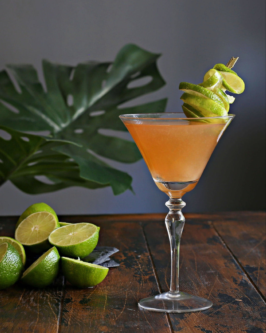 A classic Daiquiri in a chilled cocktail glass with rum, lime juice, and Rustic Oak Traditional Old Fashioned Mixer, garnished with a lime wedge.