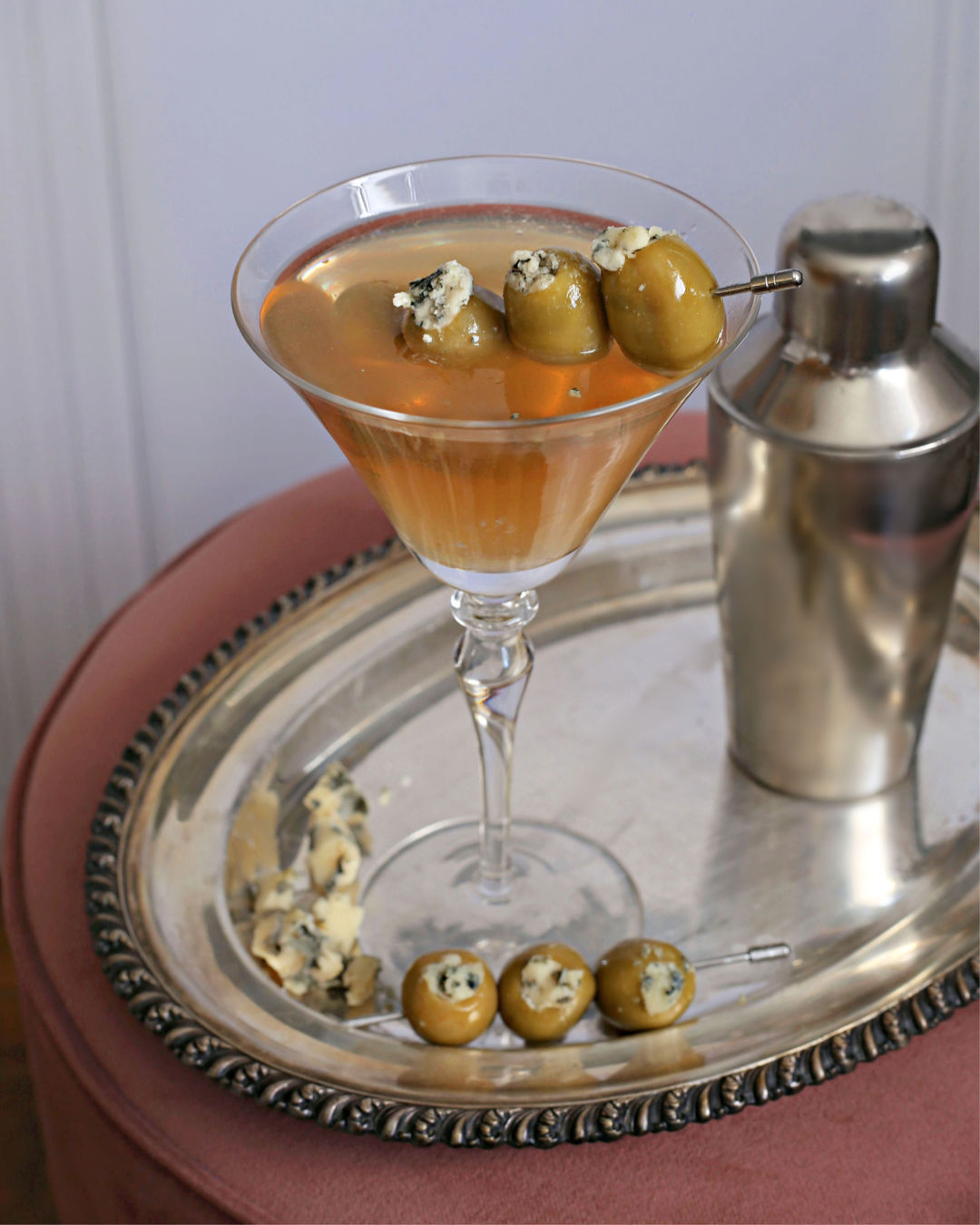 Dirty Spicy Martini with blue cheese-stuffed olives in a chilled martini glass