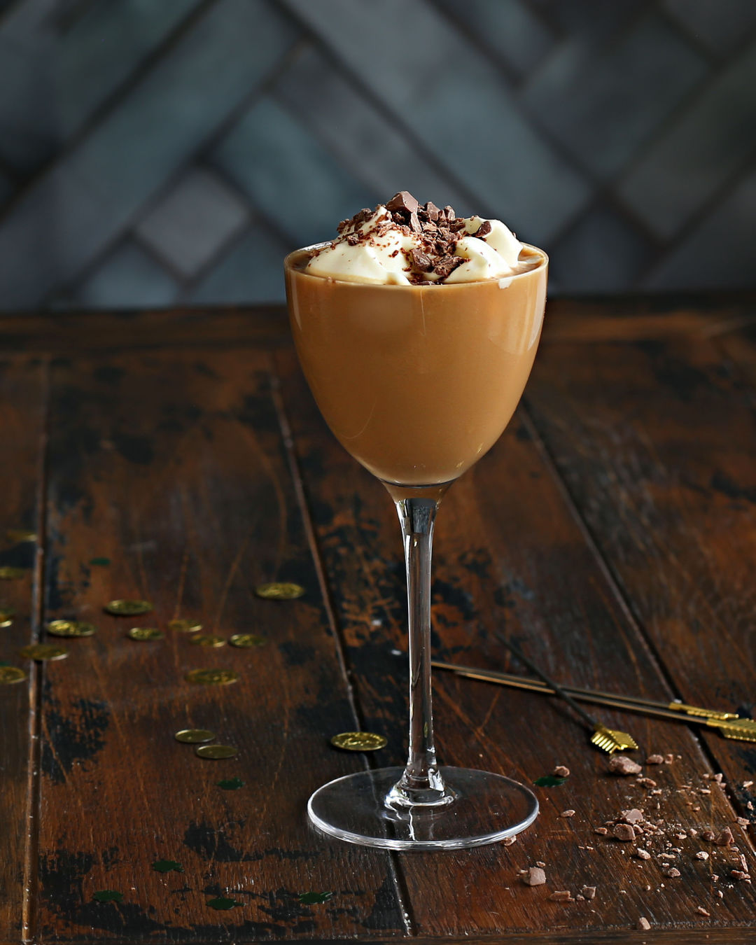 A Barrel Aged Irish Mudslide with vodka, coffee liqueur, Irish cream, and Rustic Oak Barrel Aged Mixer, topped with whipped cream and mocha bitters.