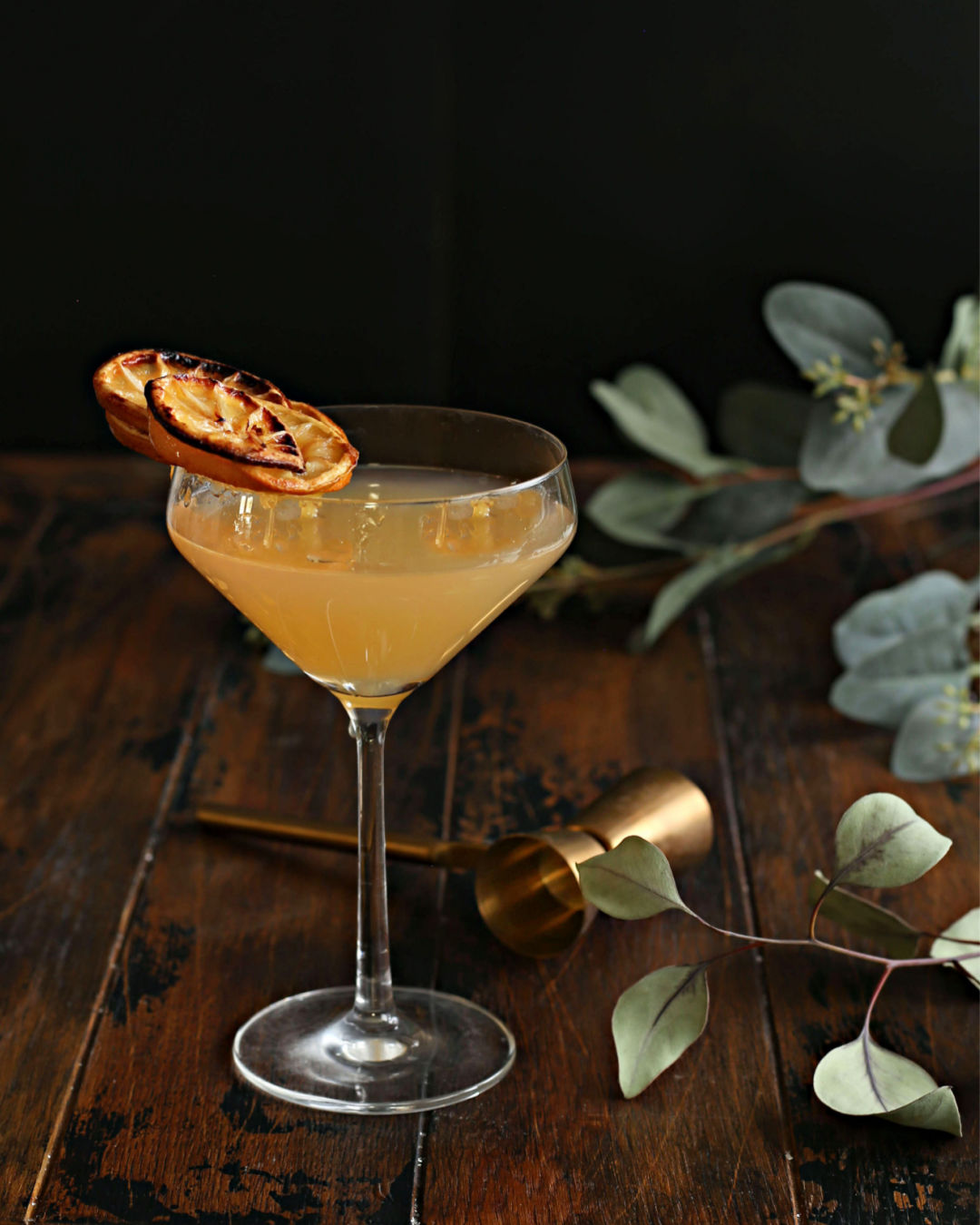 A bright Lemon Drop Martini with vodka, fresh lemon juice, and Rustic Oak Orange Mixer, served in a sugar-rimmed martini glass with a lemon twist.