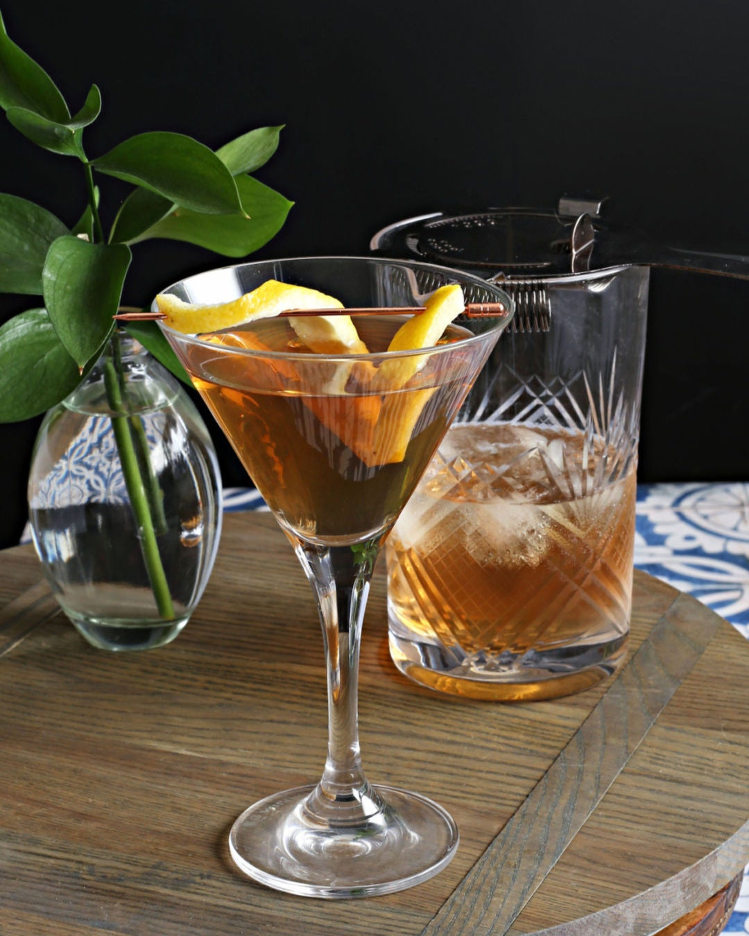 A Prohibition Twist Dry Martini in a chilled martini glass with vodka, dry vermouth, and Rustic Oak Prohibition Mixer, garnished with a lemon twist.